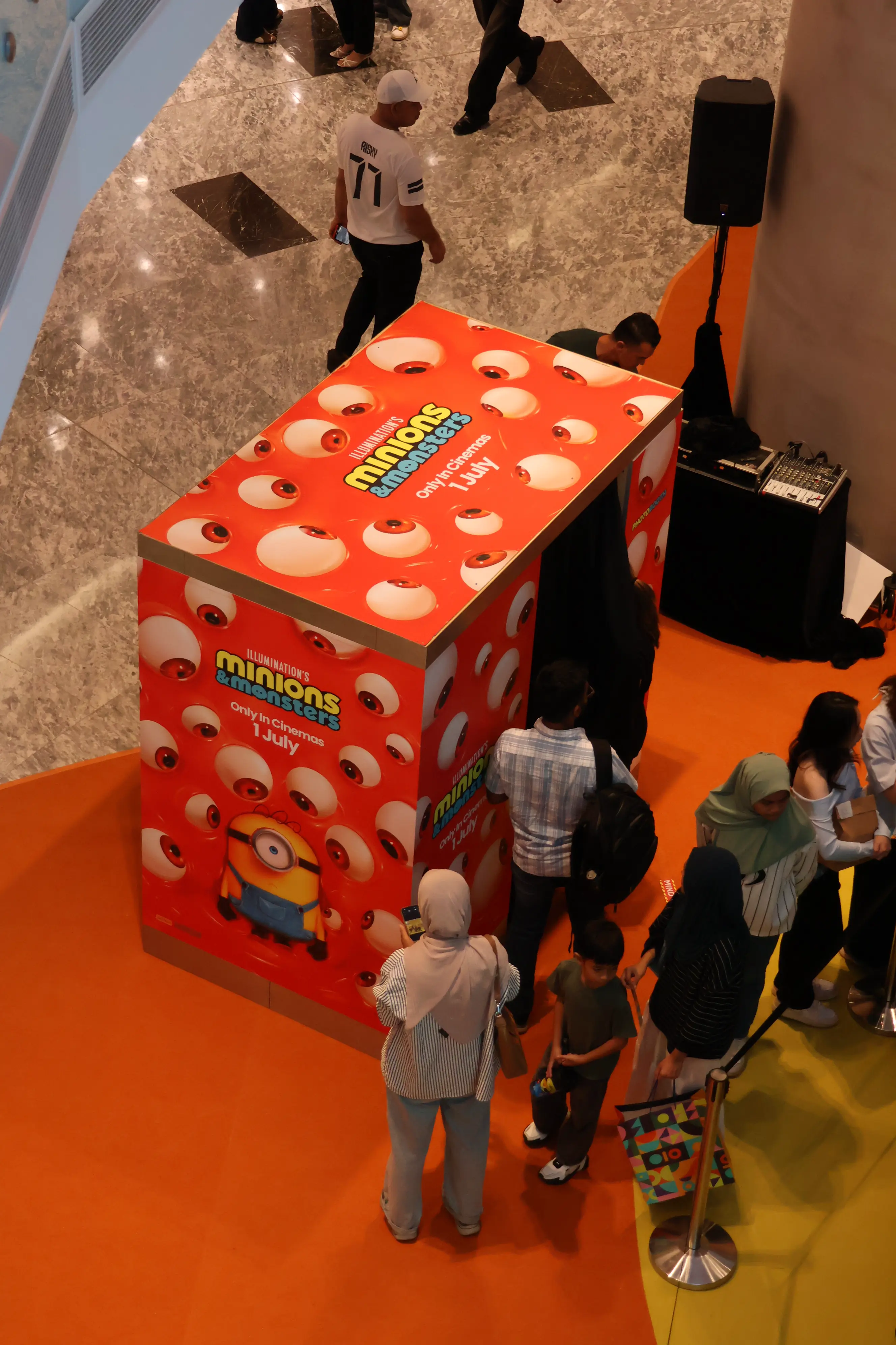 Overhead view of visitors queueing at the Minions & Monsters photo booth