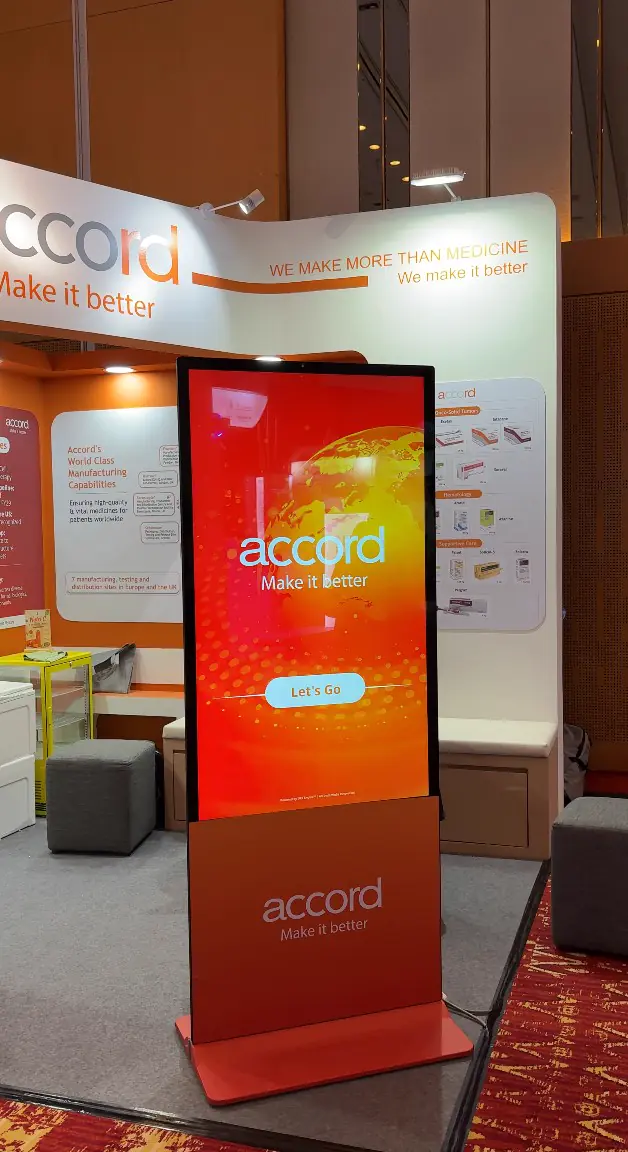 Accord branded touchscreen game kiosk showing the Let's Go start screen