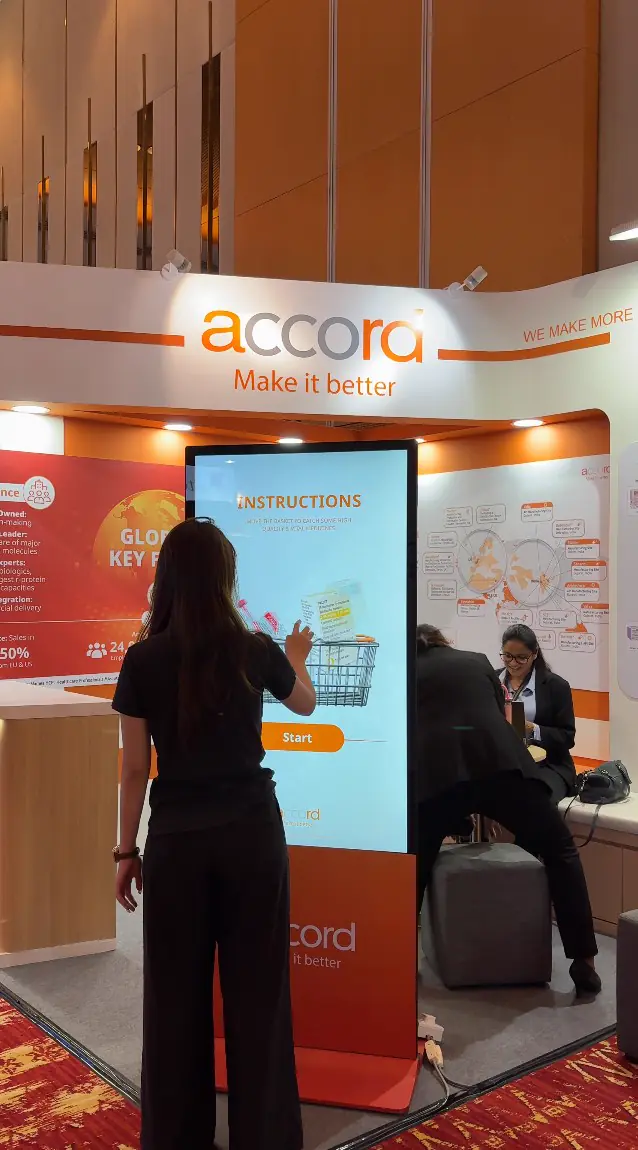 Guest reading the game instructions on the Accord touchscreen kiosk