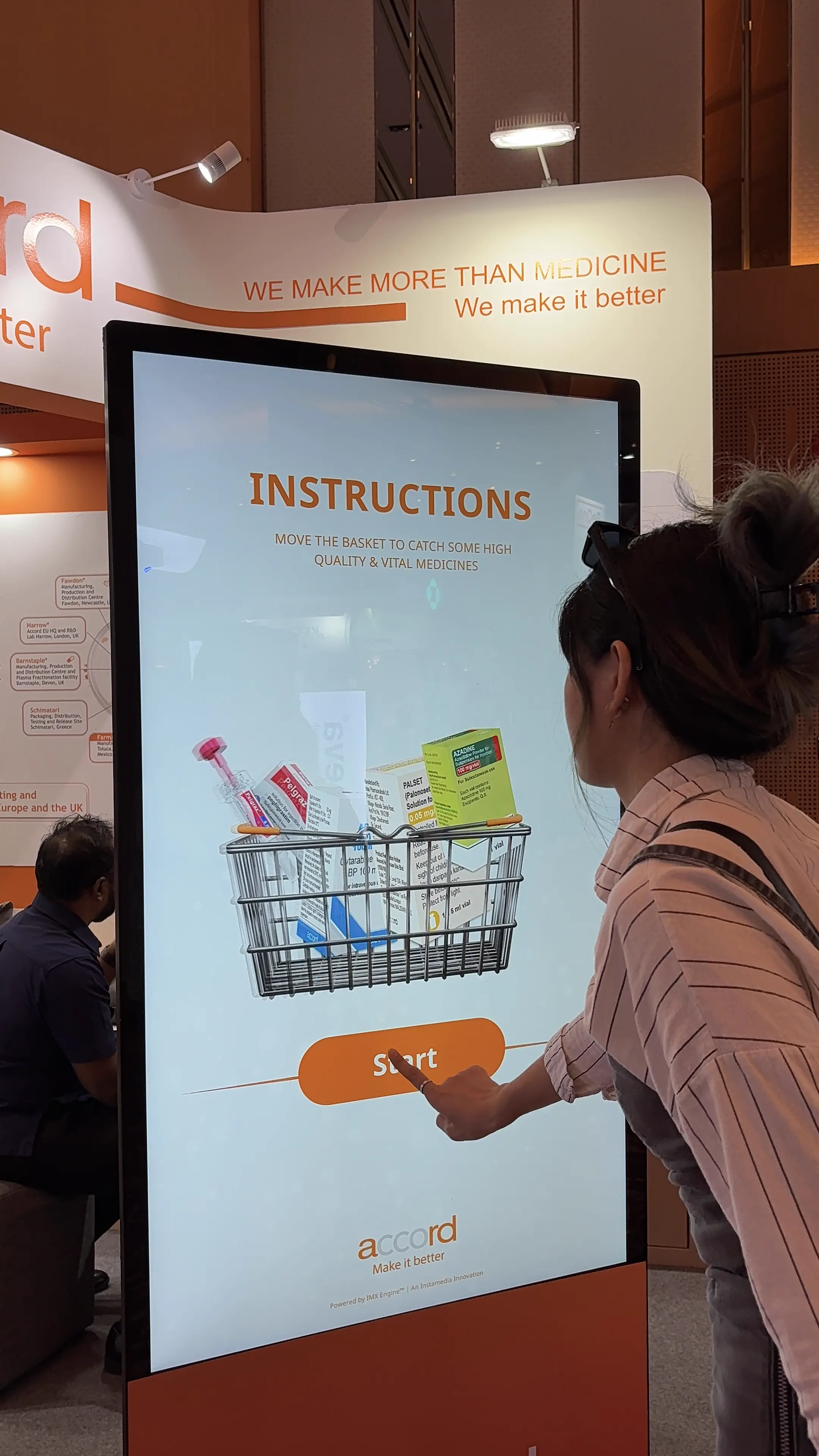 Guest pressing Start on the Accord basket game instructions screen