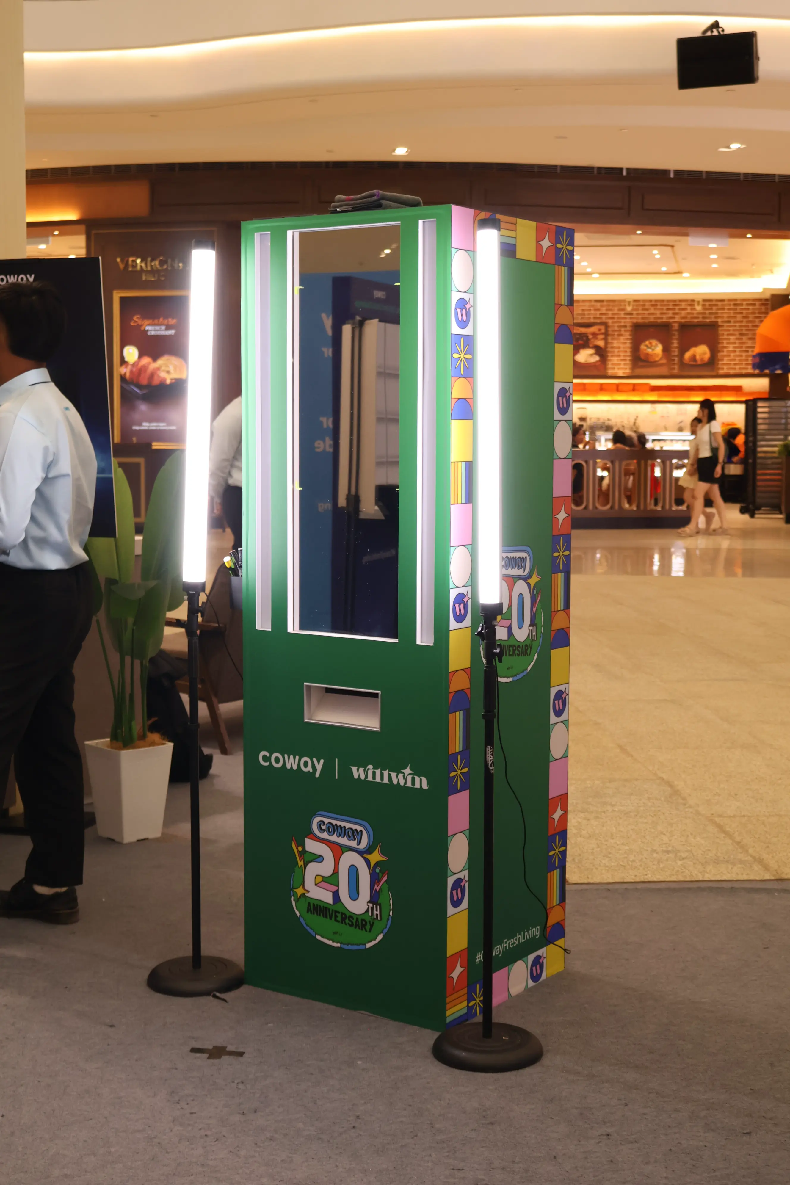 Green Coway Unveil Glass Booth with glass screen, tube lights and print slot