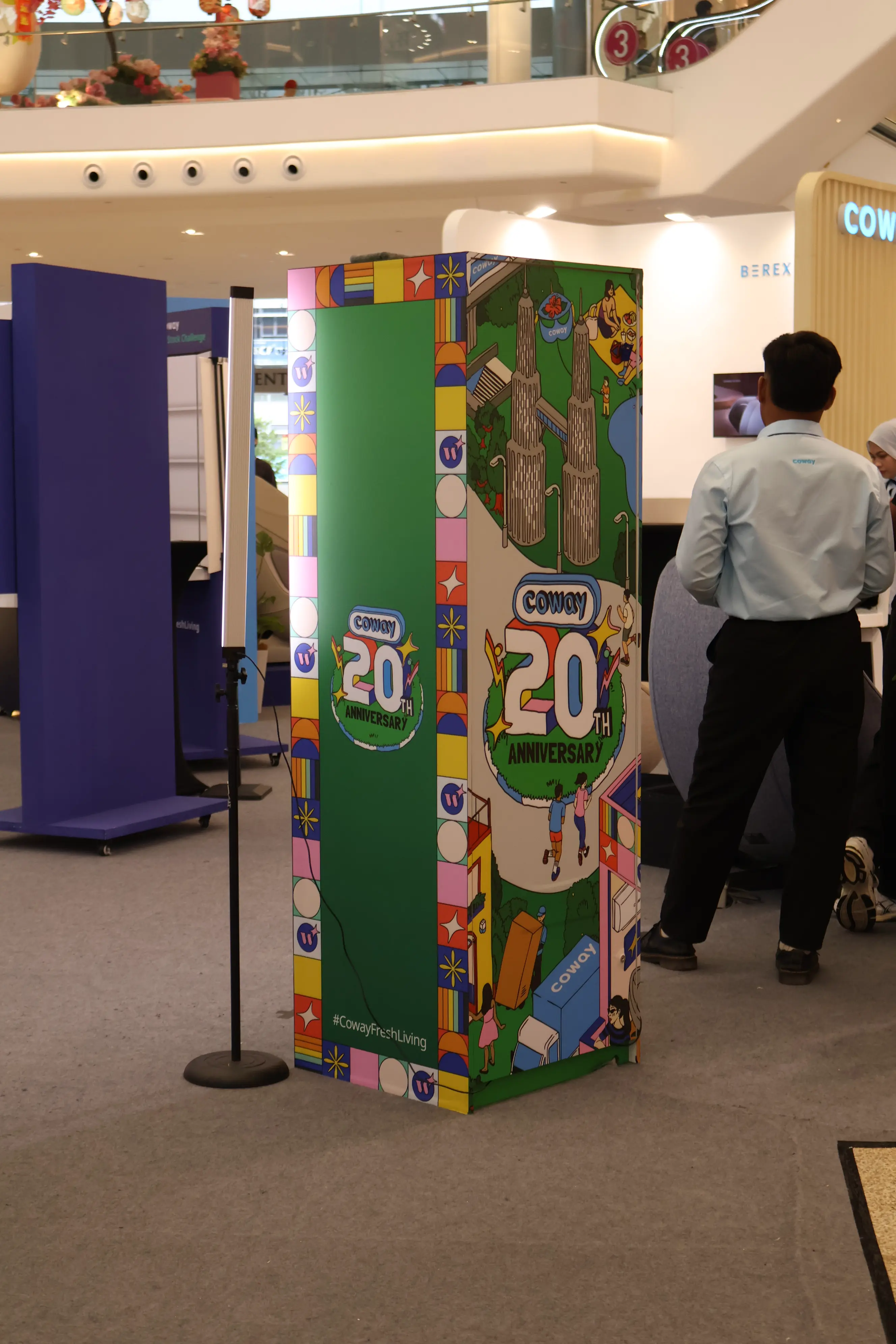 Coway 20th anniversary Unveil Glass Booth with colourful KLCC-themed artwork
