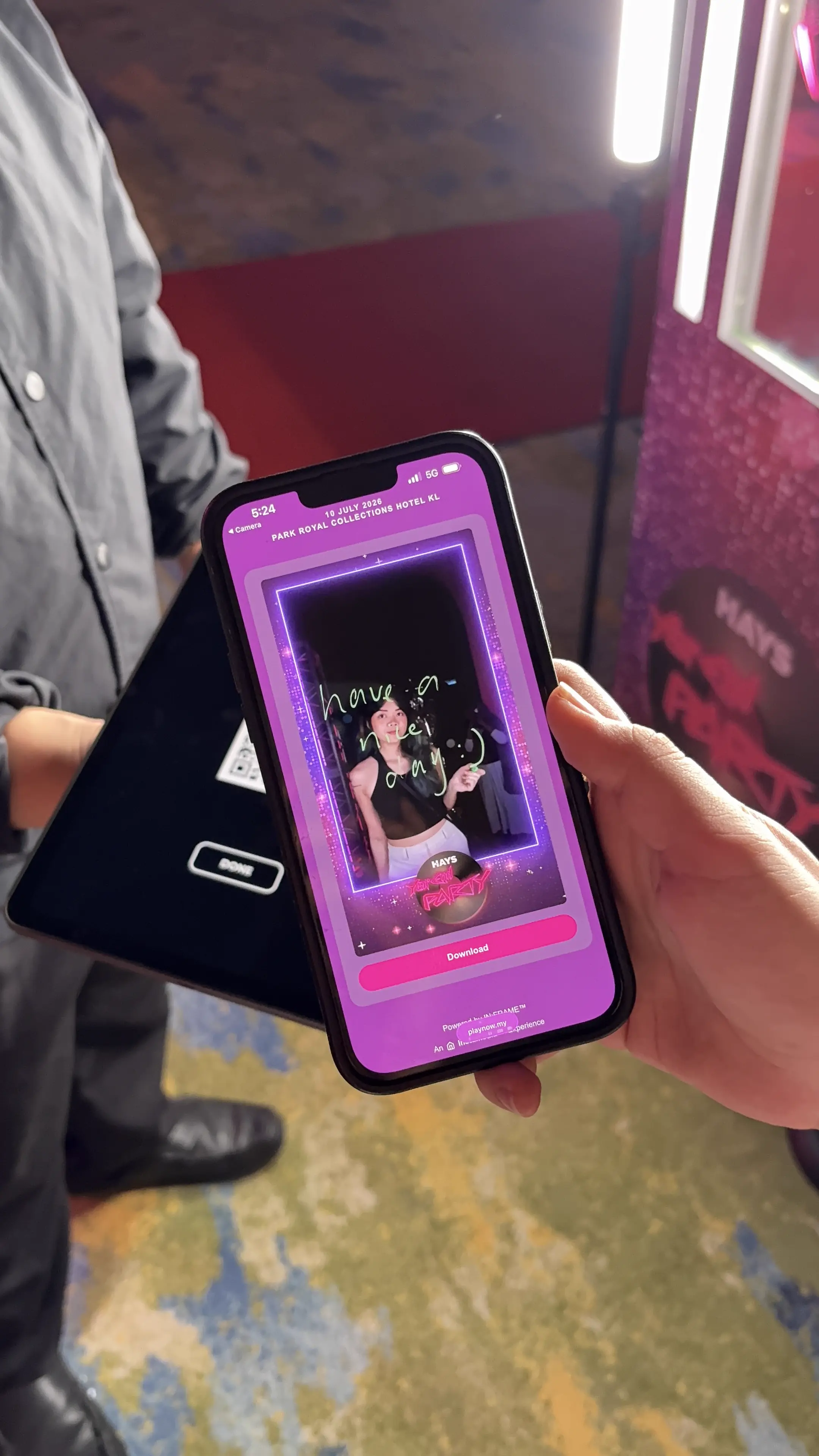 Phone showing the digital download page for a glass booth photo capture