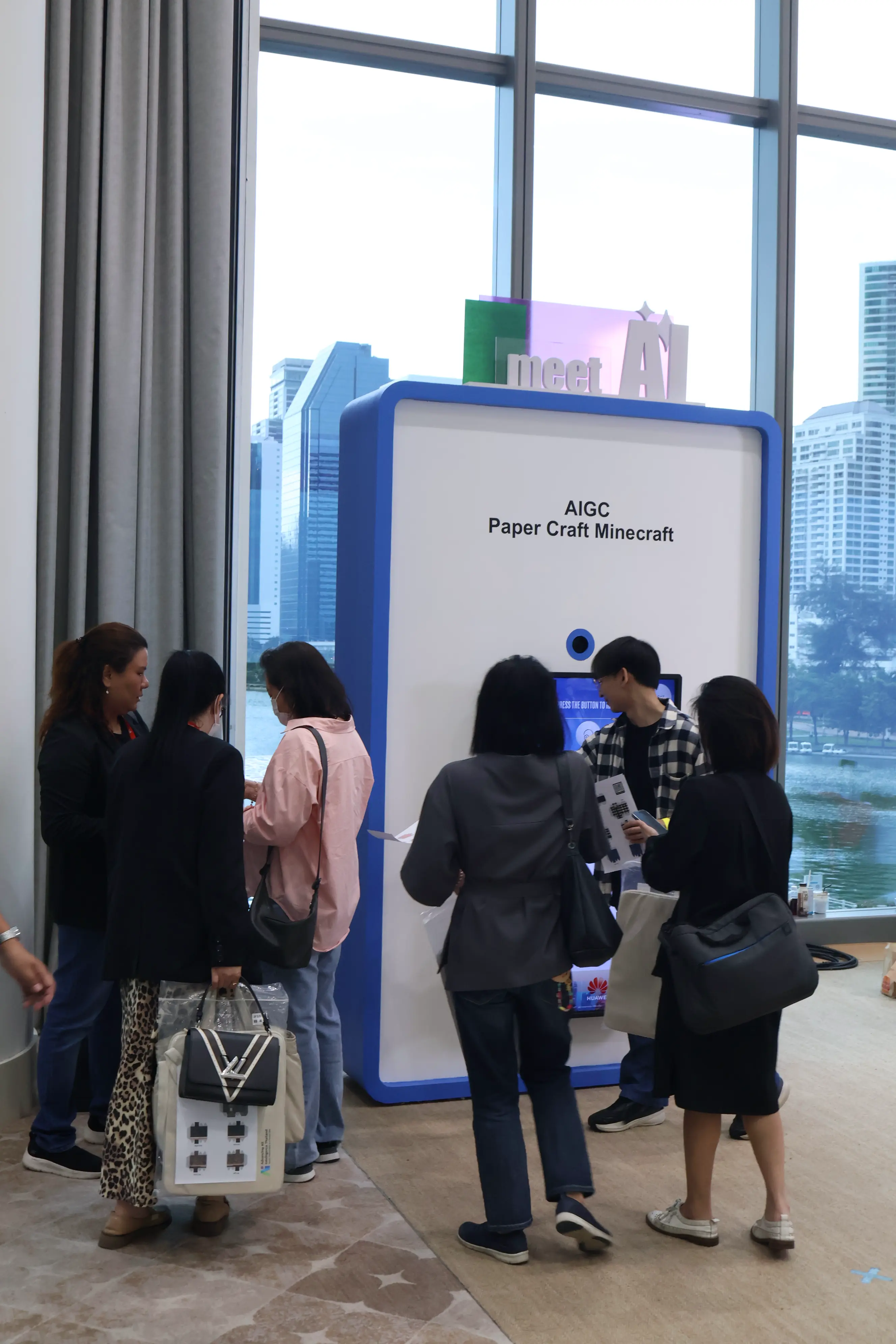 Conference attendees queueing at the AIGC Paper Craft Minecraft booth