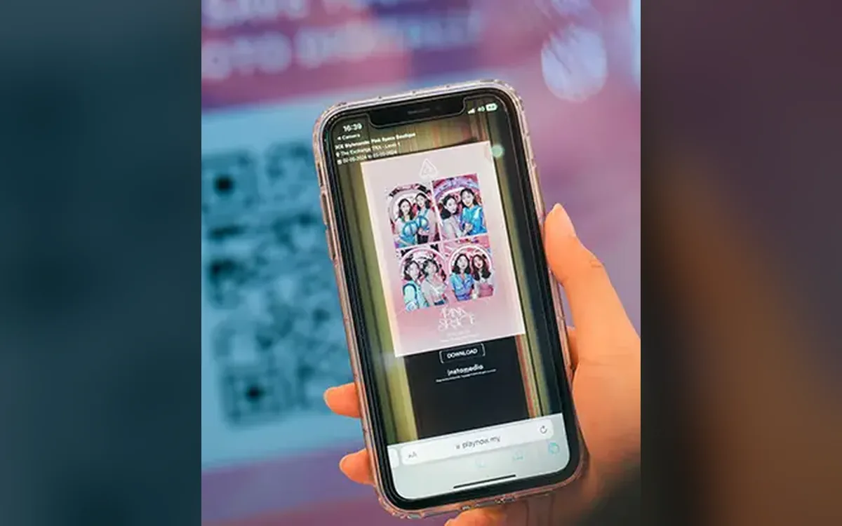 Phone showing a 3CE Pink Space AI photo booth portrait downloaded by QR code