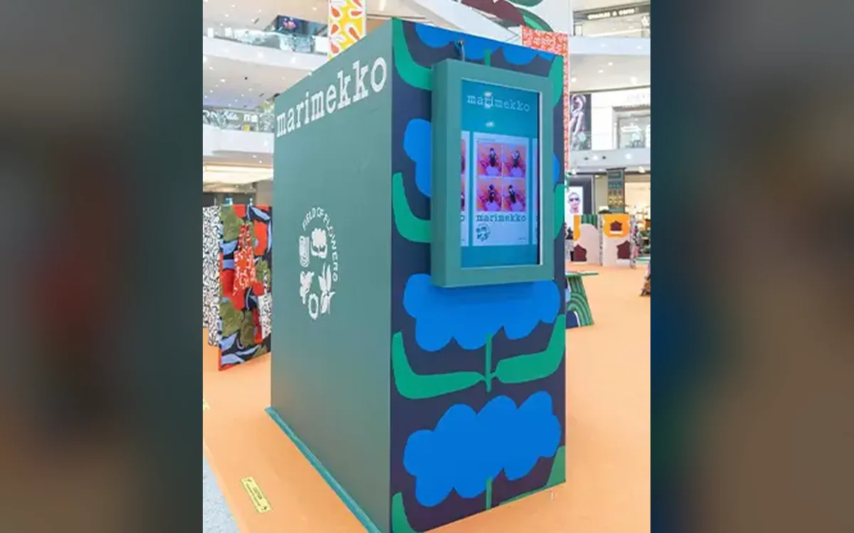 Marimekko-branded high-angle photo booth with floral pattern panels at the Field of Flowers pop-up
