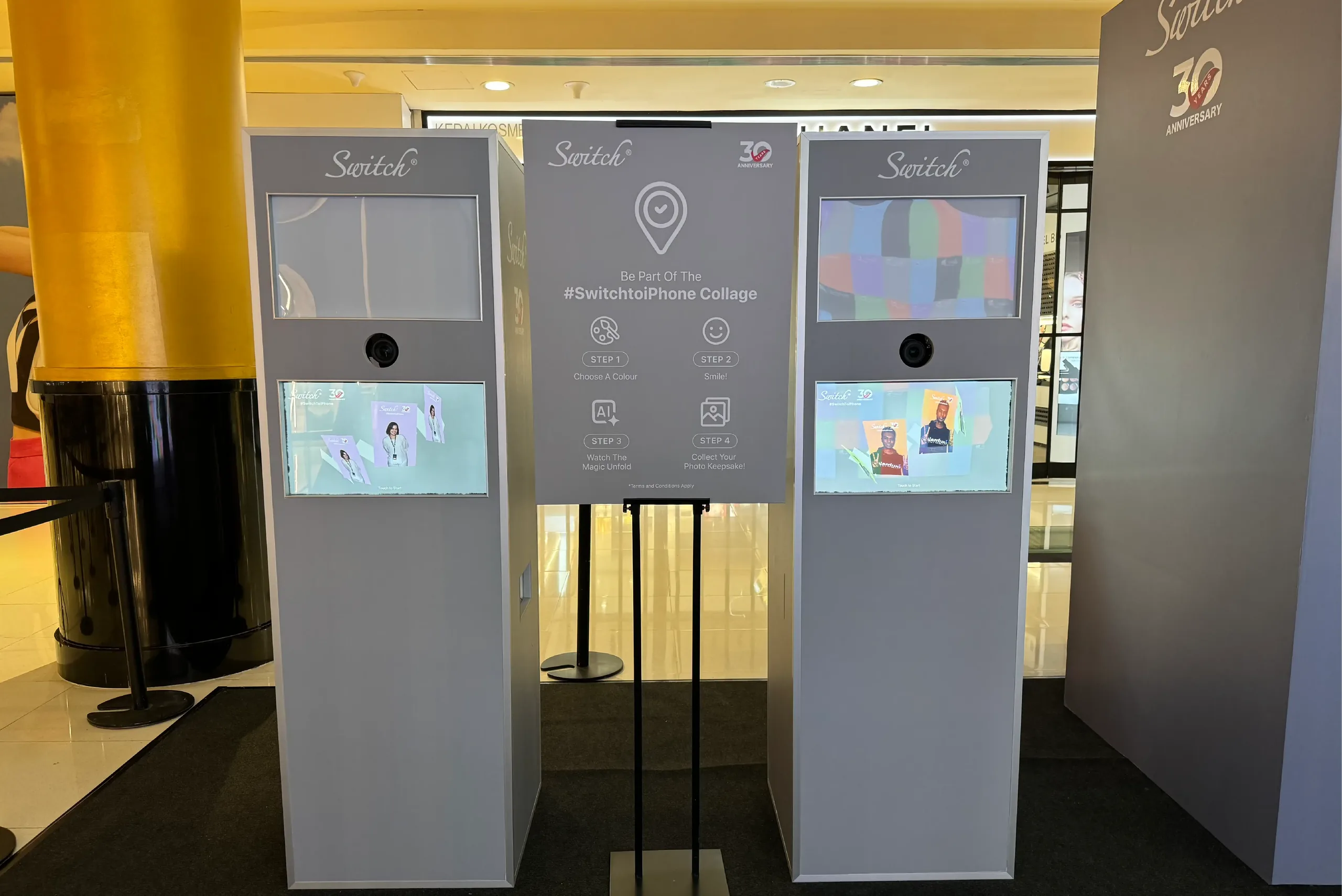 Switch-branded photo collage kiosks with step-by-step instructions displayed in a mall setting.