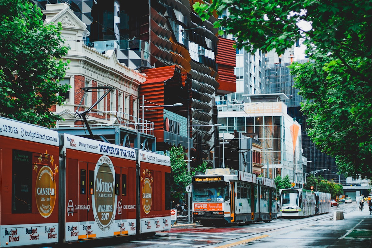 Tram on a street between buildings in Melbourne