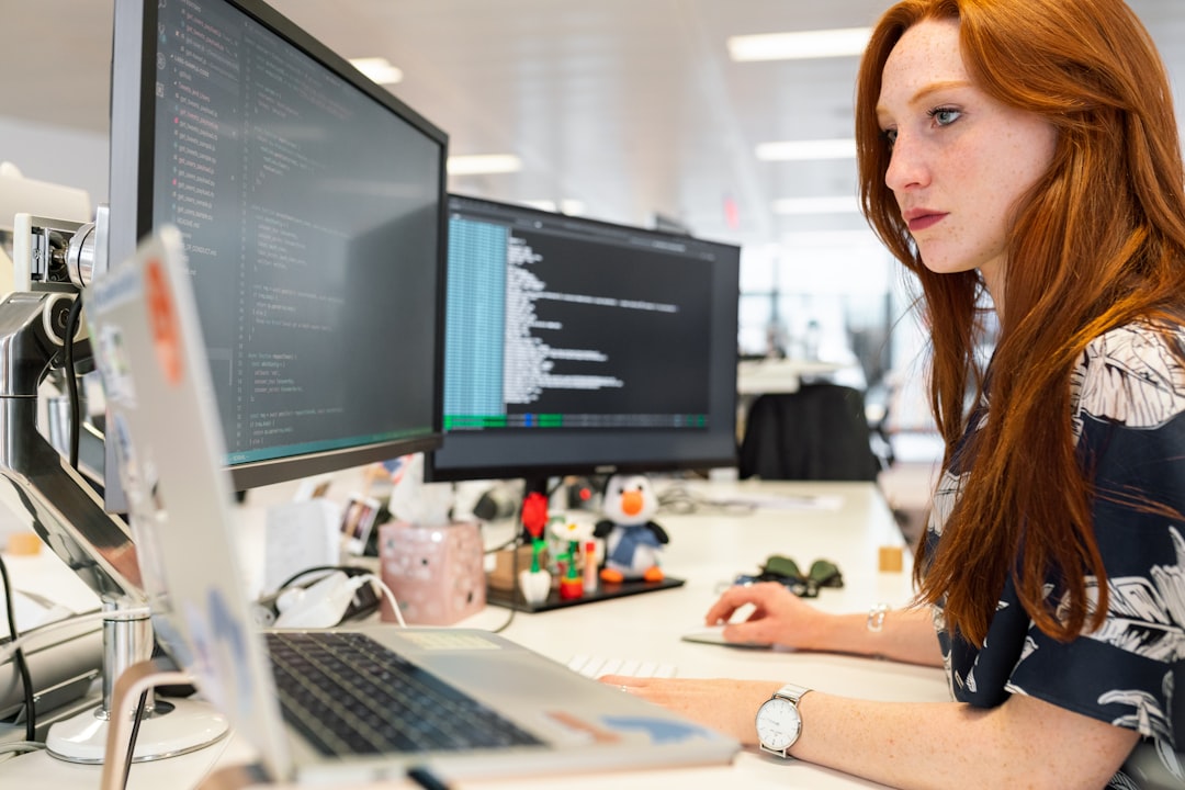 AI engineer working at a multi-monitor coding setup