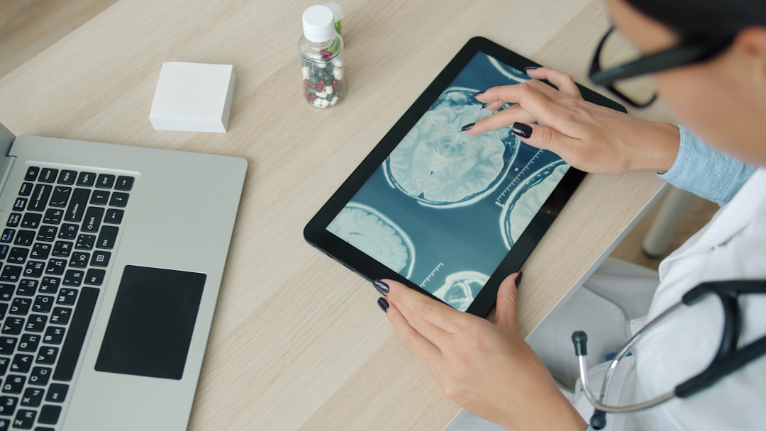 Clinician reviewing patient data on a tablet