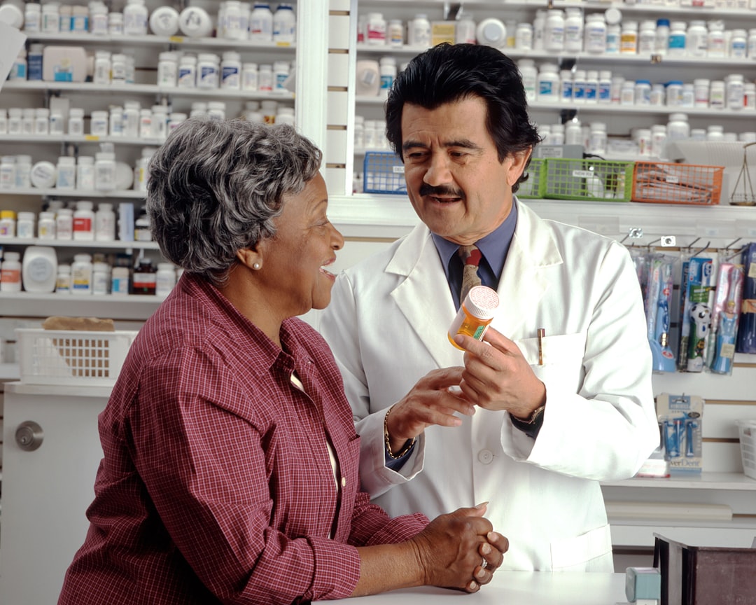 Woman consults with pharmacist about her prescription