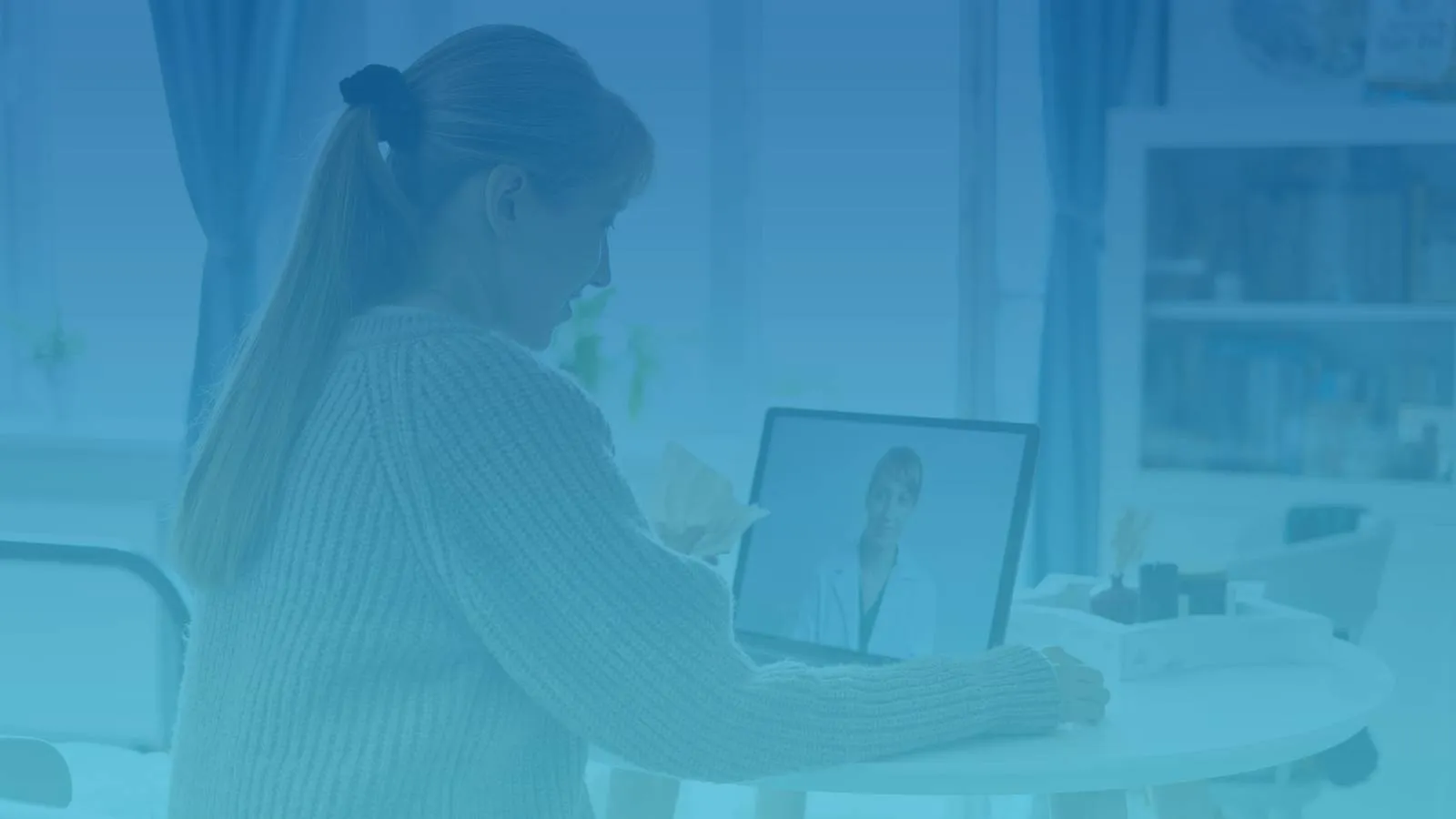 A lady in video visit with a healthcare provider.