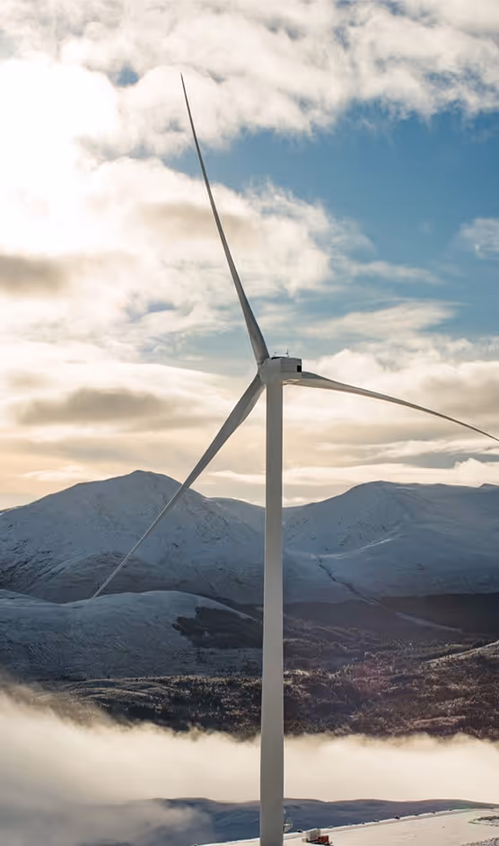 windfarm mountains in background