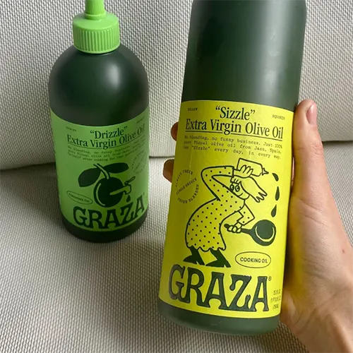 Close up of 2 Graza Olive Oil bottles
