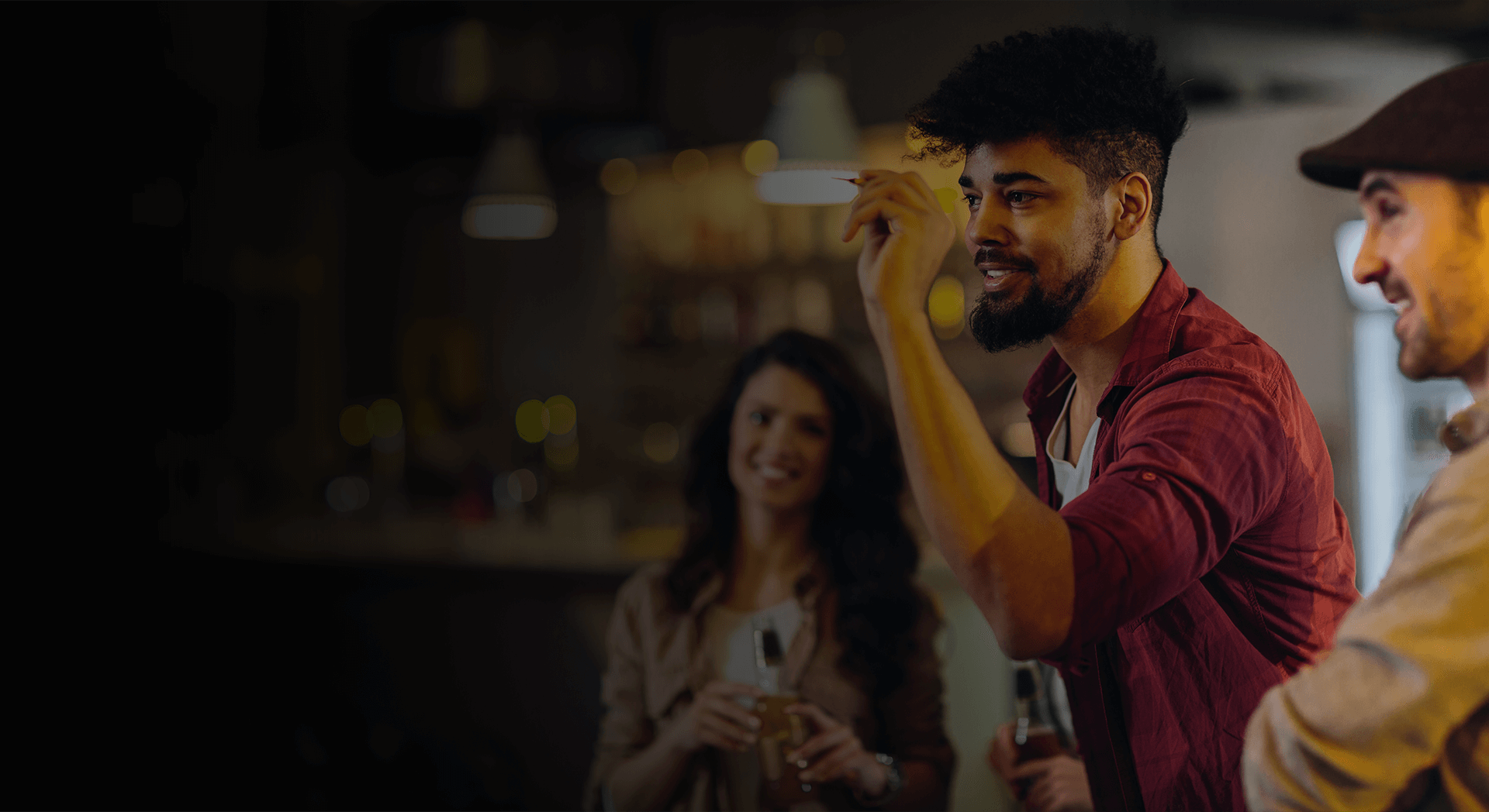 Friends playing social darts