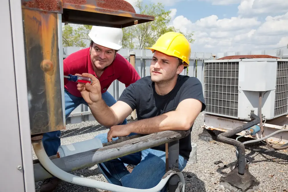 two man checking and AC console