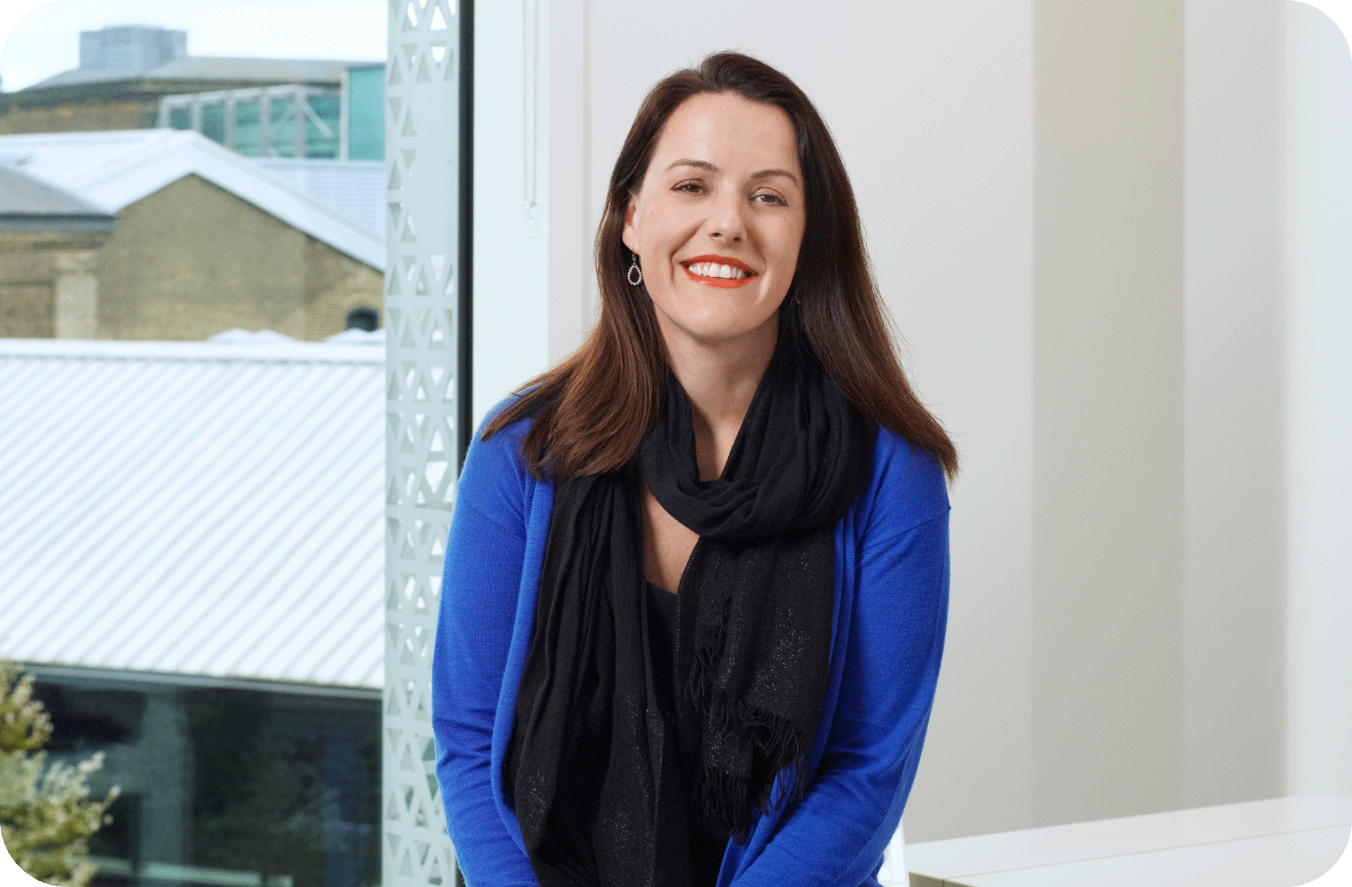 Woman with black scarf smiling