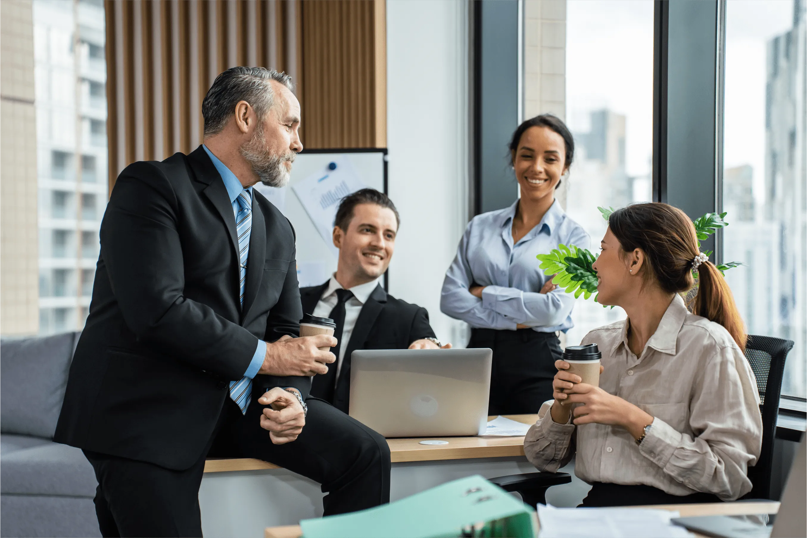 a group of co-workers having a discussion in the office