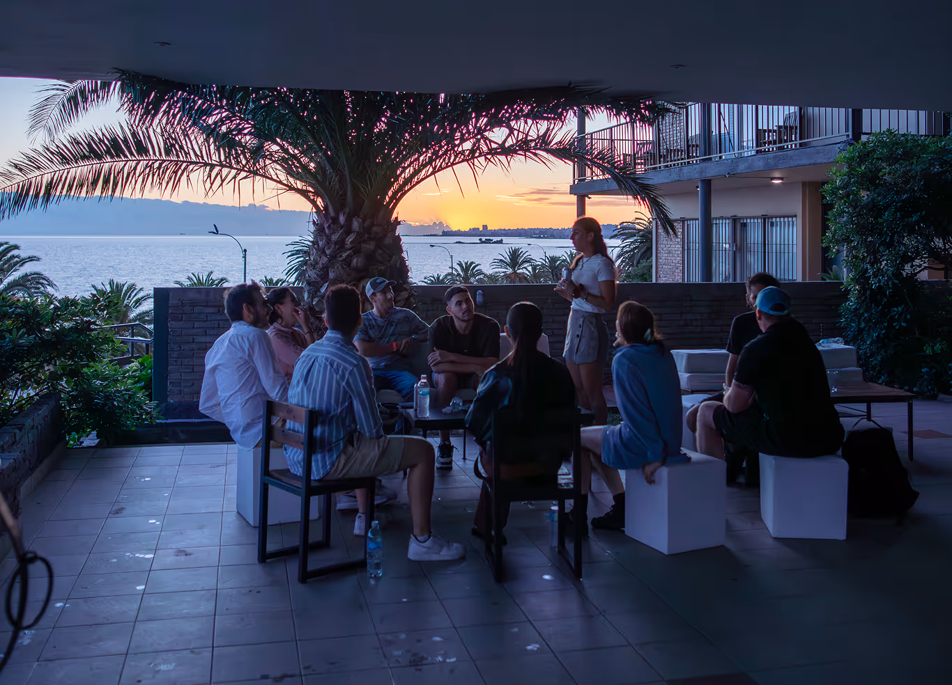 Our software development team connecting and sharing ideas in a relaxed setting during a company retreat, highlighting our commitment to team building and a positive work culture.