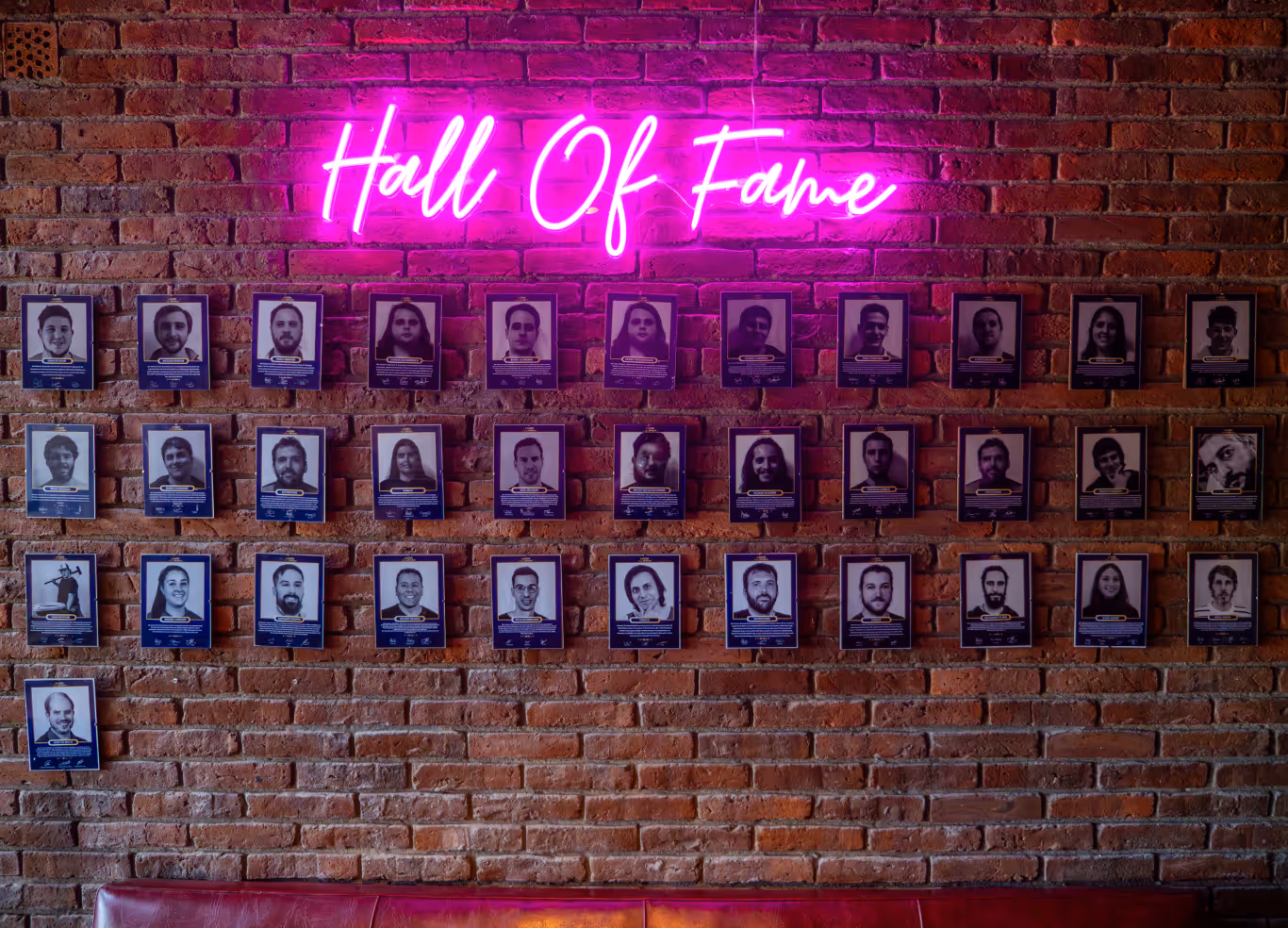Our 'Hall of Fame' wall, a testament to the talented developers and team members who are the foundation of our company's success.