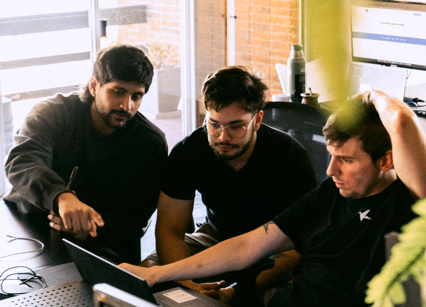 Our dedicated team of software engineers collaborating on a custom software project in our Montevideo office.
