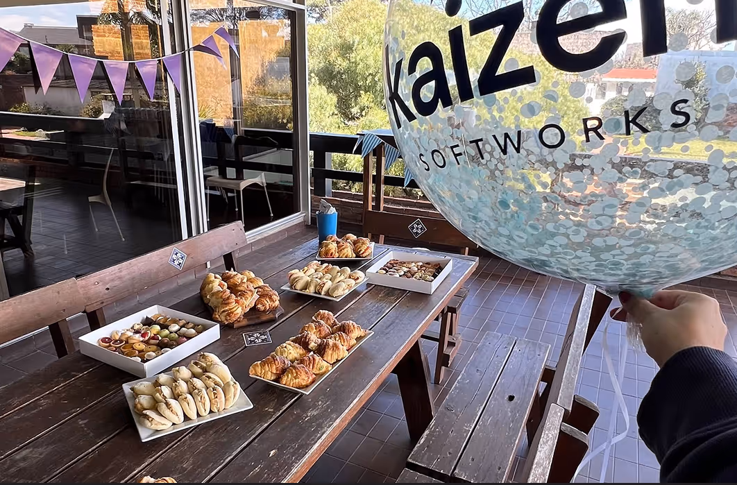 Celebrating our team's success with a shared breakfast at the Kaizen Softworks office in Montevideo. This captures our vibrant company culture, where we value camaraderie and take time to enjoy our achievements together.