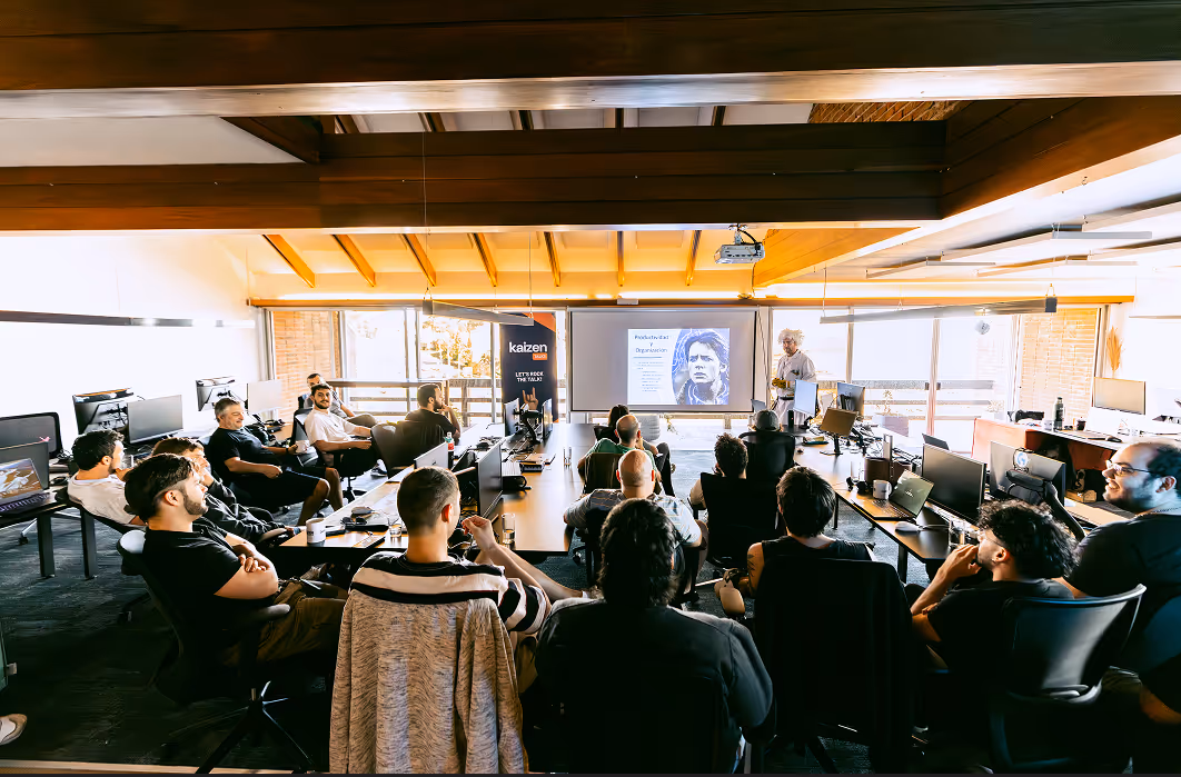 The entire Kaizen Softworks team gathered for a tech talk at our Montevideo office. These company-wide events foster transparency, align us on our mission, and provide a platform for our experts to share knowledge.
