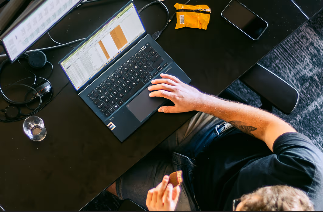 A developer at Kaizen Softworks engaged in deep work, meticulously coding a project. This highlights our commitment to providing an environment where engineers can focus and master their craft.