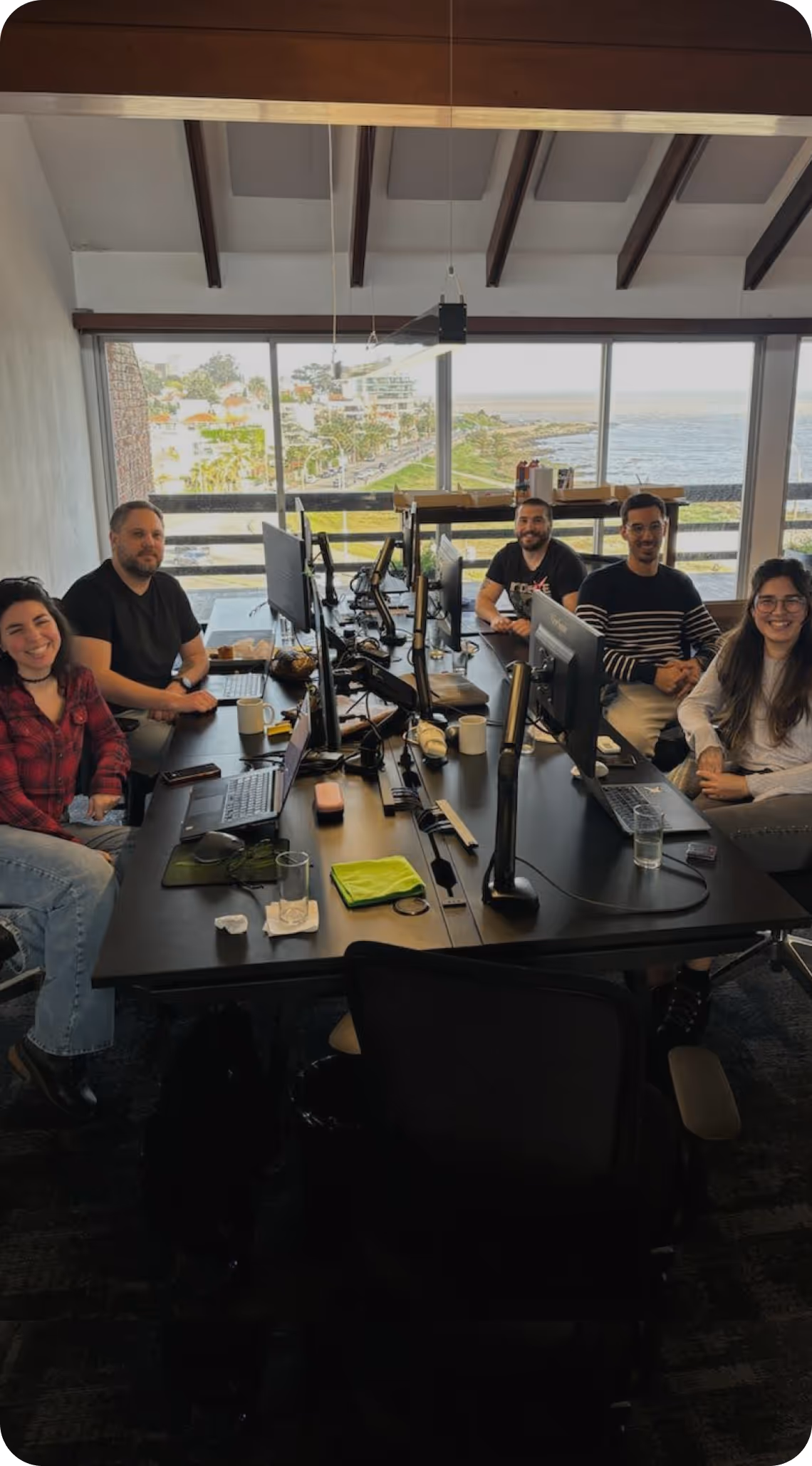 The Kaizen Softworks UX Design team in a collaborative work session at our Montevideo office. Our designers work closely together, showcasing our integrated, agile approach to building software.