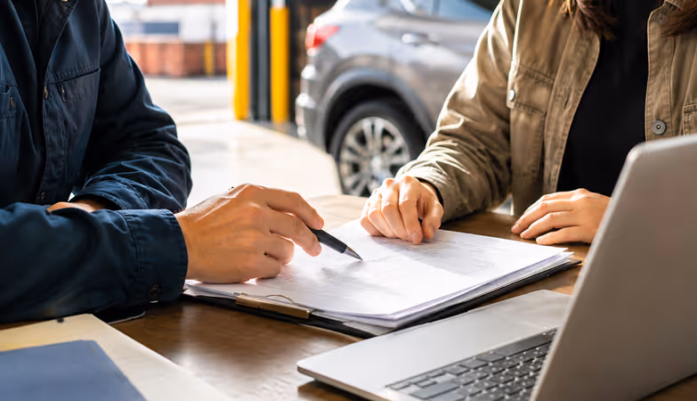 First-time vehicle exporters reviewing documents and using a guided workflow to complete export requirements.