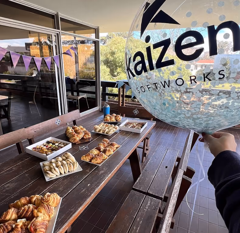 Kaizen team celebrating a birthday together.