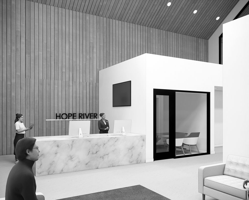 Reception area with modern design at HOPE RIVER, featuring a marble desk and minimalist interiors