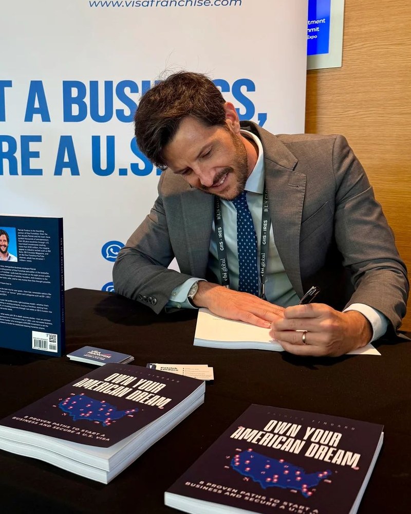 Patrick Findaro signing his book Own Your American Dream
