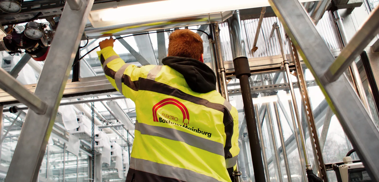 An electrical fitter at work on a construction site
