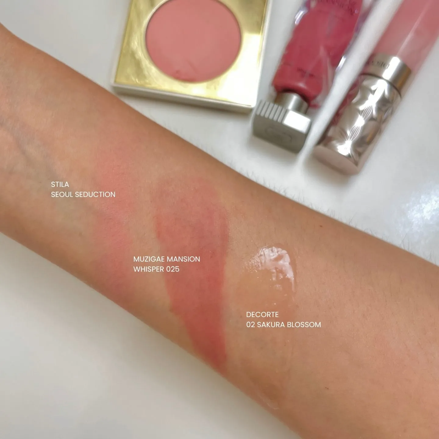 Stila Seoul Seduction, Muzigae Mansion Whisper 025, Decorté 02 Sakura Blossom 컬러 팔목 발색 이미지 (Wrist swatch of Stila Seoul Seduction, Muzigae Mansion Whisper 025, and Decorté 02 Sakura Blossom shades)