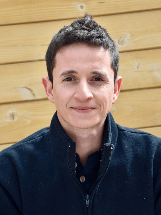 a man smiling for a picture