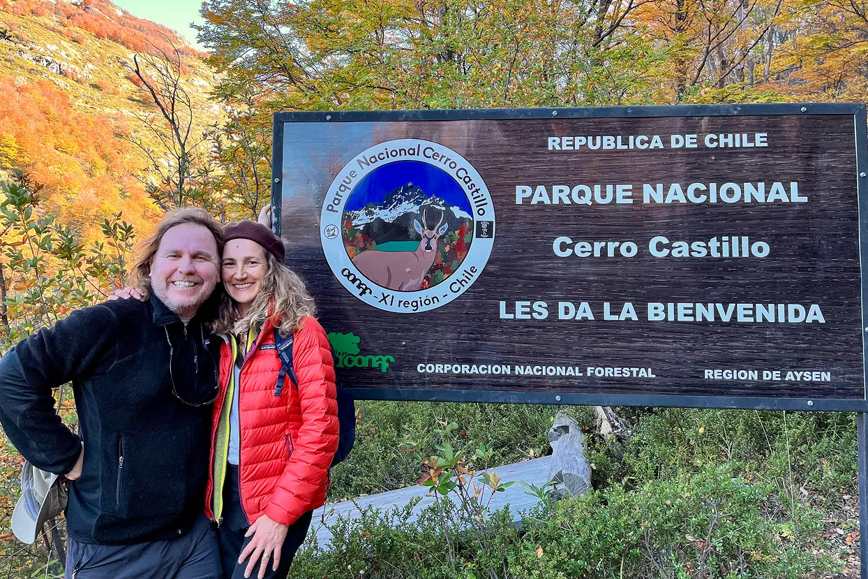 Visitors at the entrance sign of Cerro Castillo National Park in Patagonia Chile.