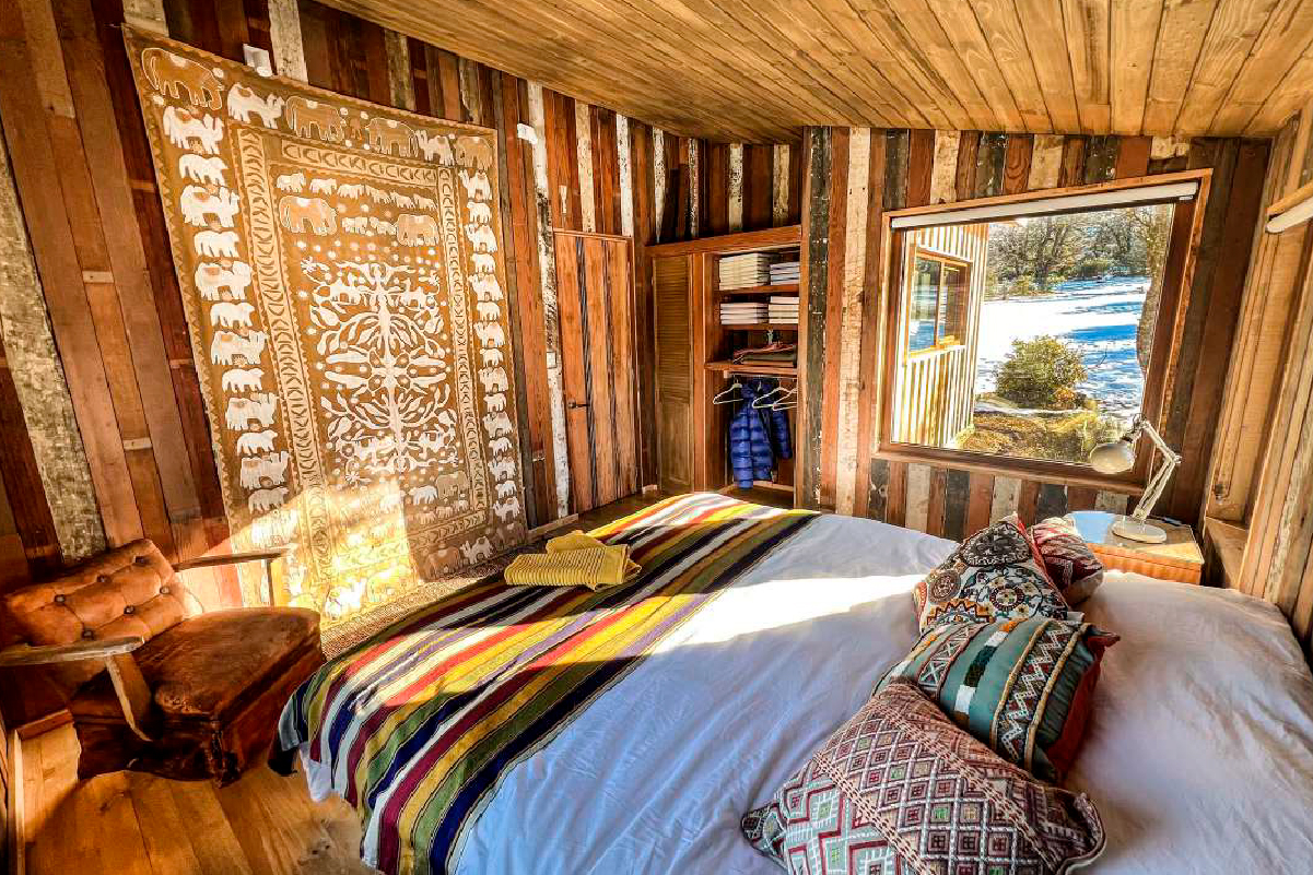 Private bedroom with panoramic Cerro Castillo views at Beyond the Castillo lodge, Chile
