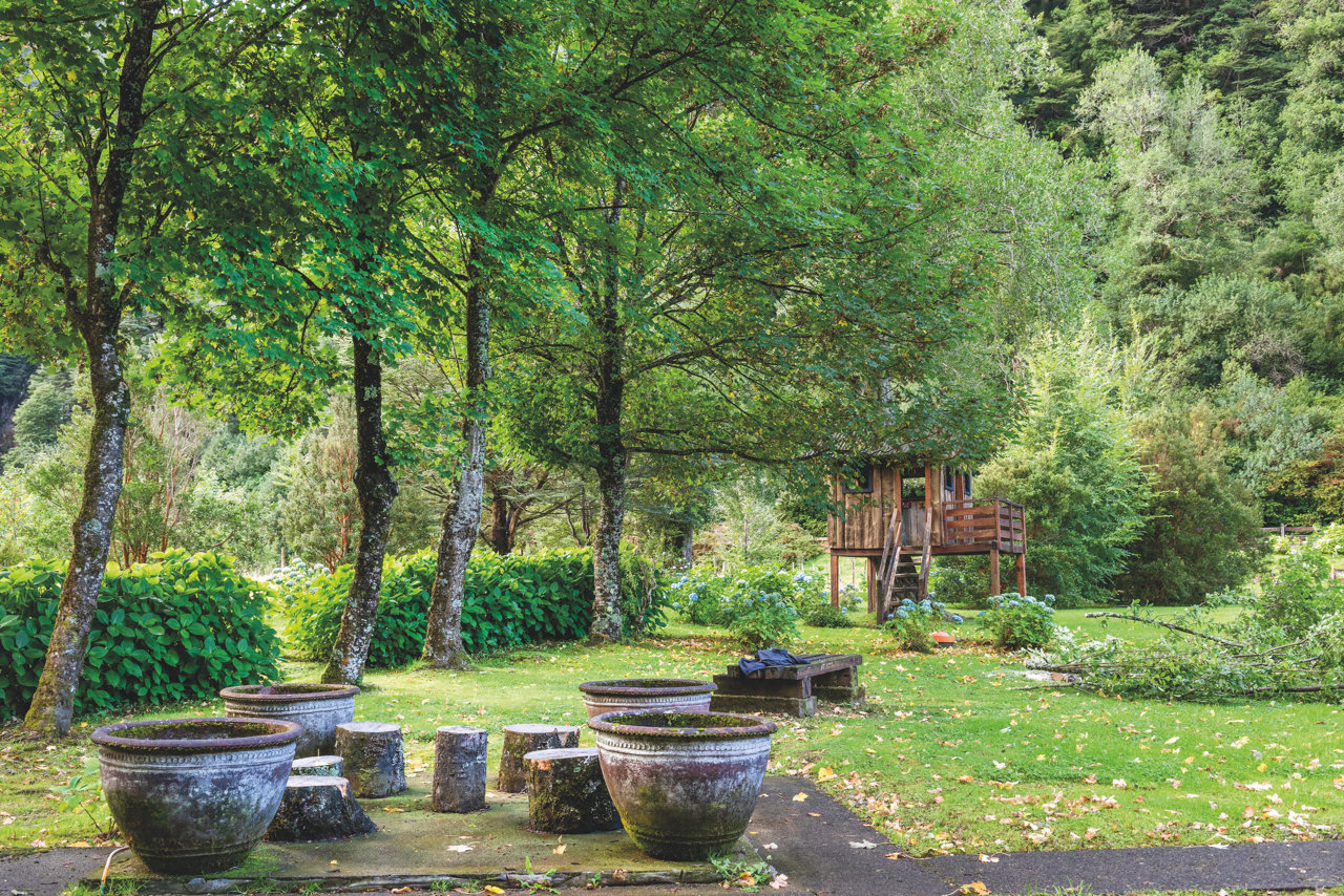 Gardens and children's tree house at a family-friendly lodge near Coyhaique, Patagonia