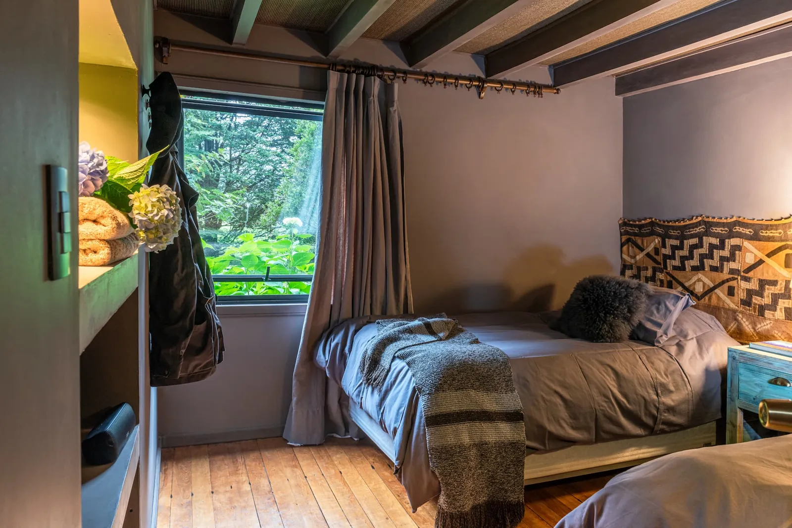 Cottage twin bedroom with garden views at Parque Cascadas, Carretera Austral