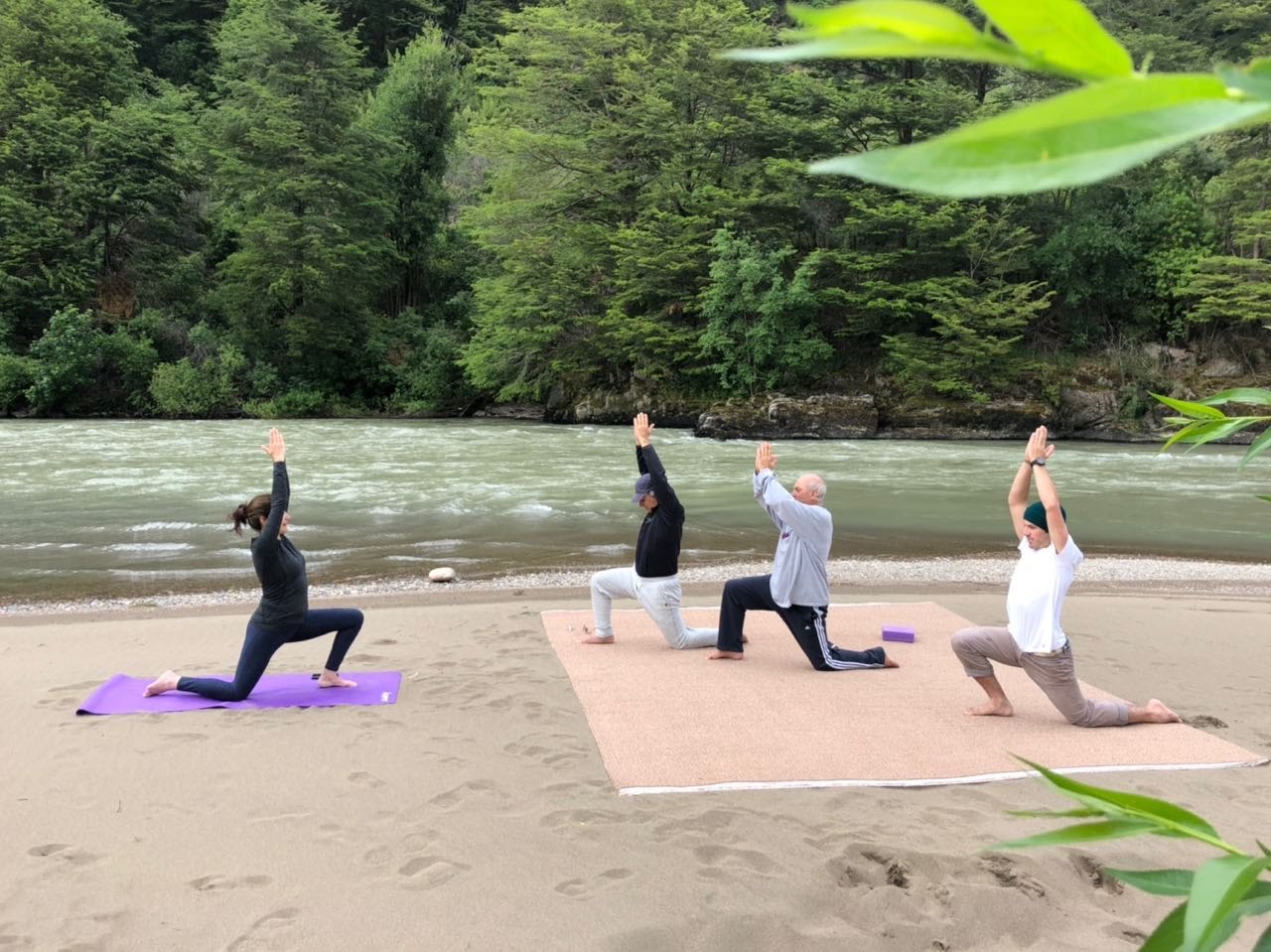 Morning yoga on the Río Simpson river beach at Parque Cascadas, Aysén