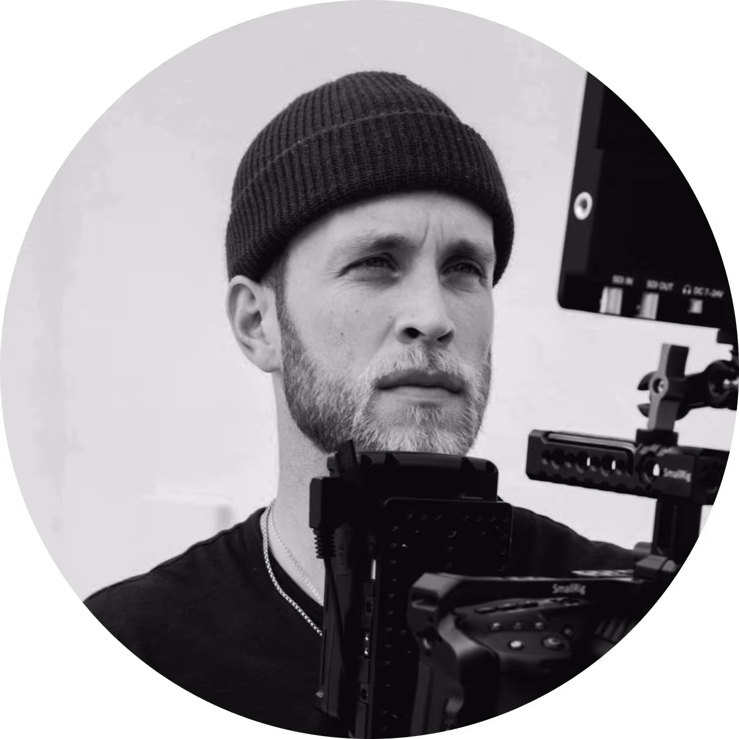 Filmmaker behind the camera watching visuals in the monitor.