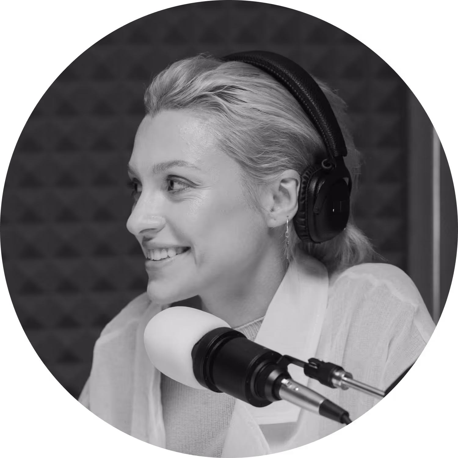 A presenter in a studio mid conversation.