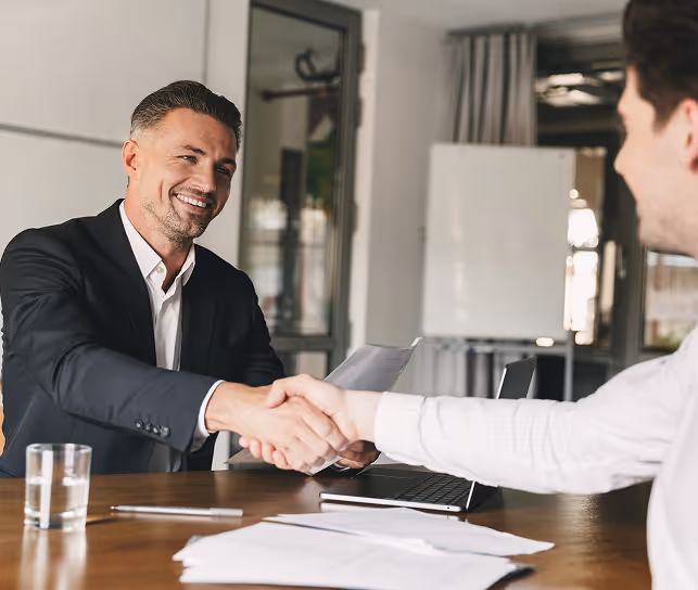 man shaking hands at interview