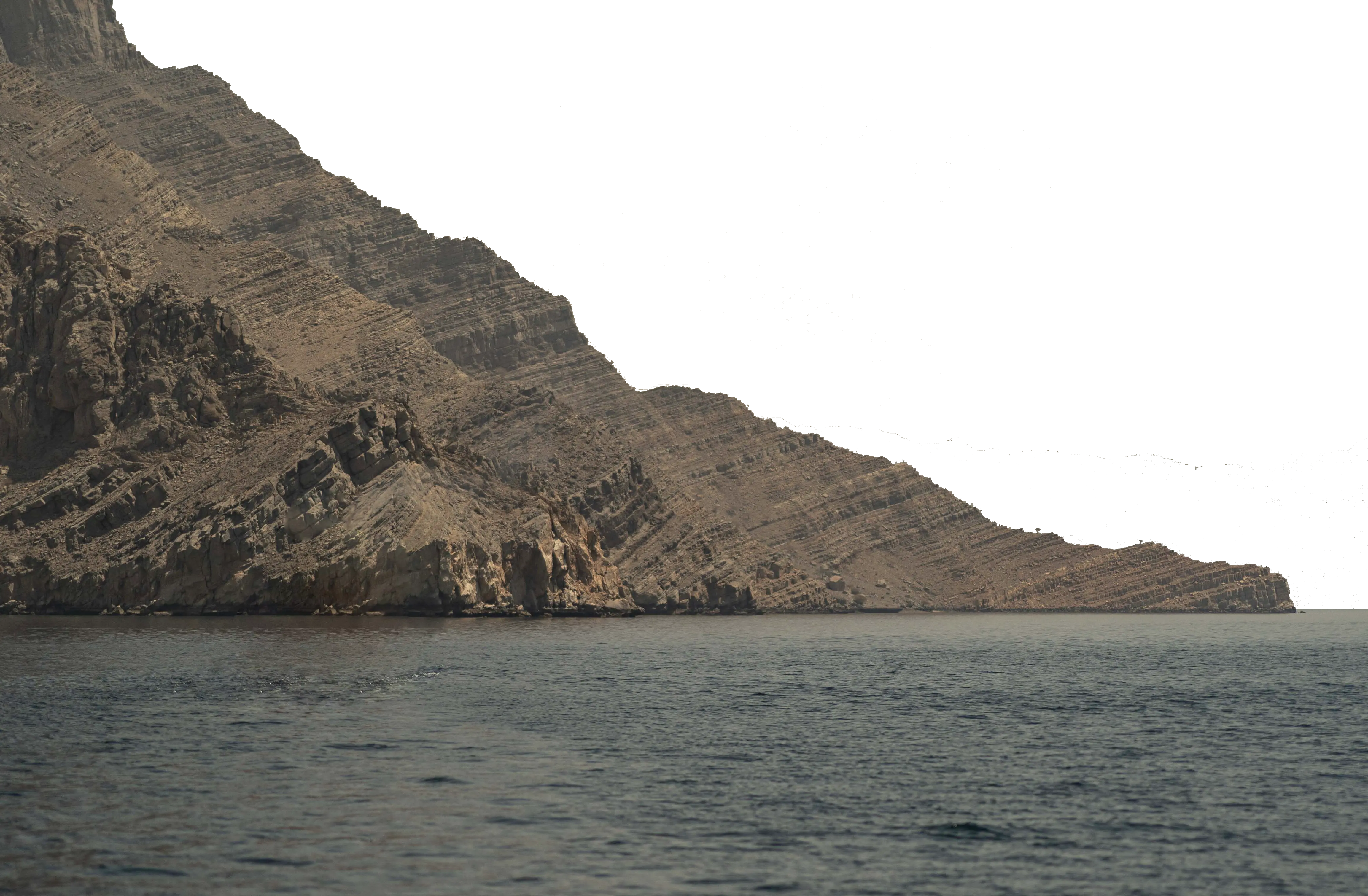 This is a layer for a parallax scrolling effect. A mountains-scape rises from the water. 