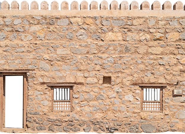 the cutout of a castle fort wall in khasab used in the parallax effect, where it slides in from the bottom, overlaying some text. 