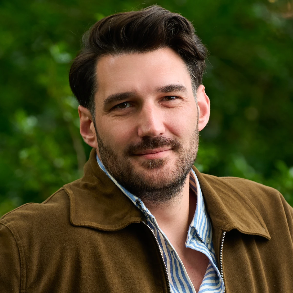 A headshot of the team member.