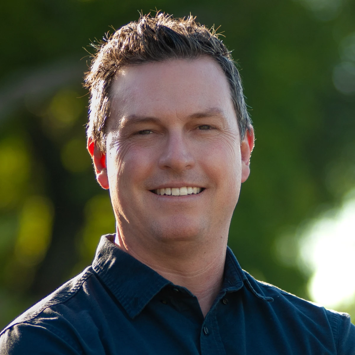 A headshot of the team member.