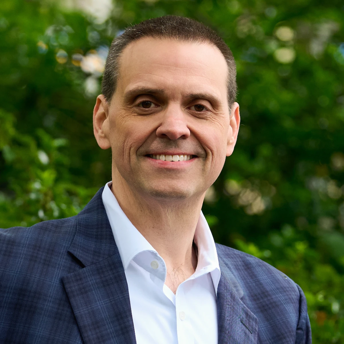 A headshot of the team member.