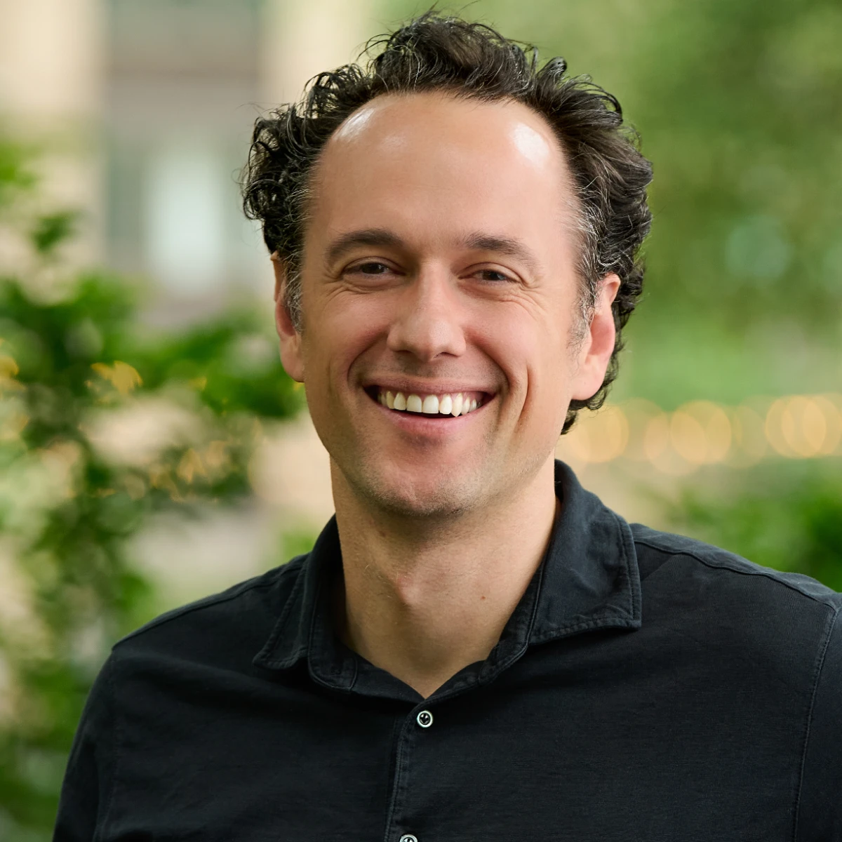 A headshot of the team member.